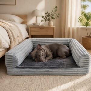 Sofá con rulos de peluche de canalé gris azulado para perro
